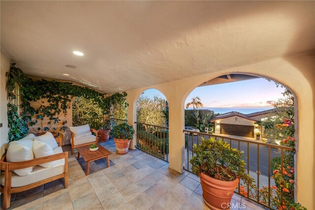 patio terrace at dusk with a balcony