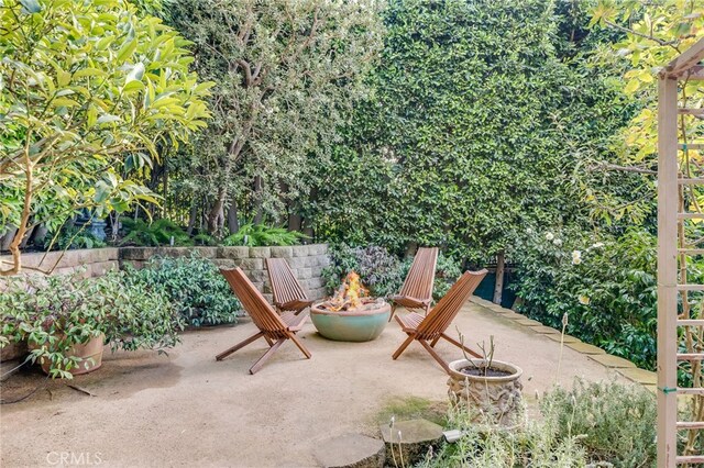 view of patio with an outdoor fire pit