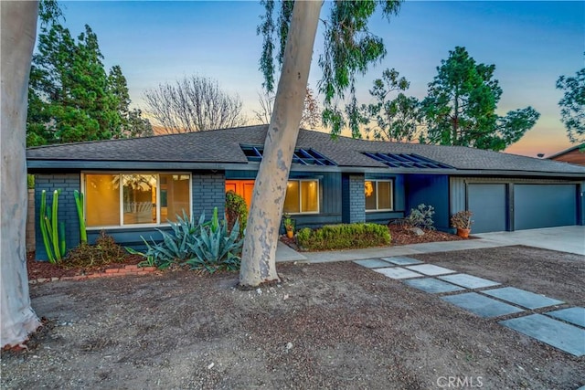 single story home featuring a garage