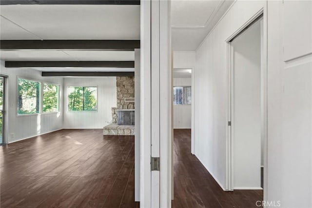 hall with dark hardwood / wood-style floors and beamed ceiling