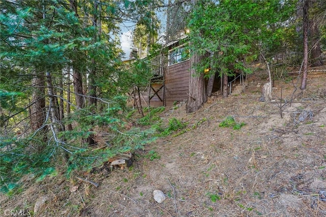 view of yard with a wooden deck