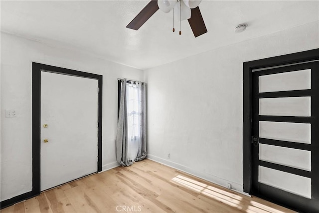 interior space featuring ceiling fan and light wood-type flooring