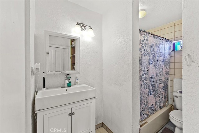 full bathroom featuring shower / tub combo, vanity, and toilet