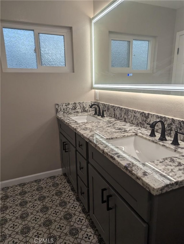 bathroom with tile patterned flooring and vanity