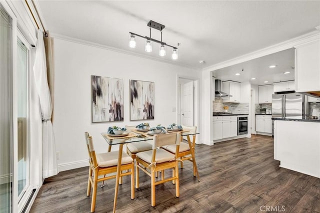 dining room with dark hardwood / wood-style floors and ornamental molding