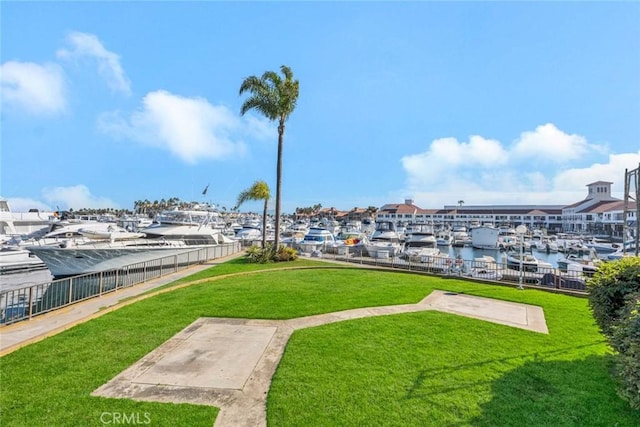 exterior space with a lawn and a water view