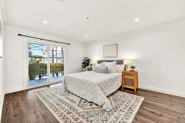 bedroom featuring access to exterior, crown molding, and hardwood / wood-style floors