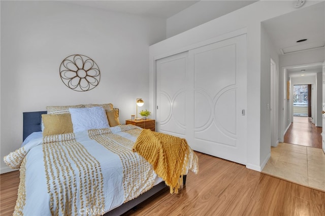 bedroom featuring hardwood / wood-style flooring and a closet