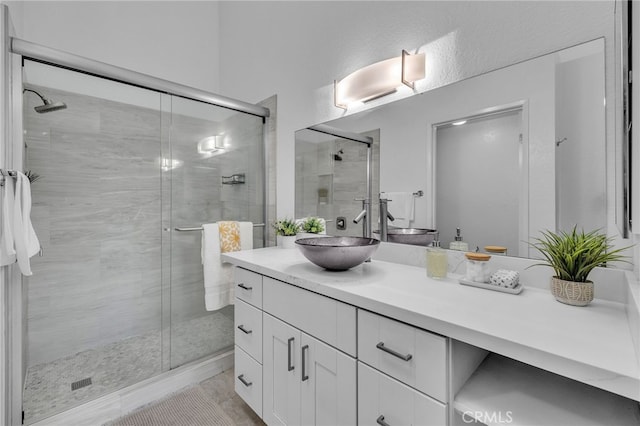 bathroom featuring vanity and walk in shower