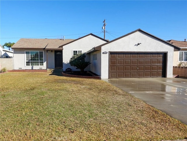 ranch-style house with a front yard and a garage