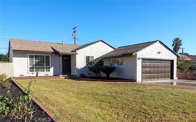 ranch-style home with a front lawn and a garage