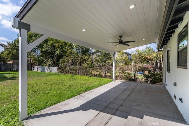 view of patio / terrace featuring ceiling fan and fence