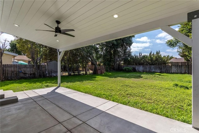 view of patio with ceiling fan and a fenced backyard