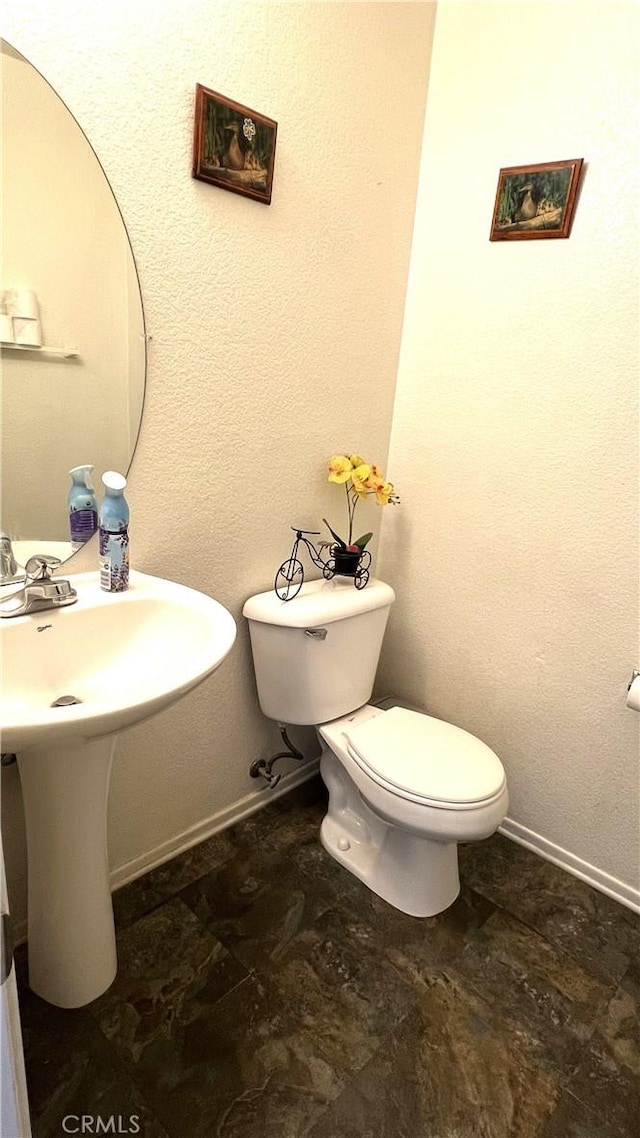 bathroom featuring toilet