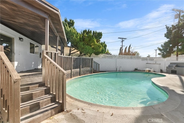 view of pool featuring a fenced in pool, a fenced backyard, and a patio area