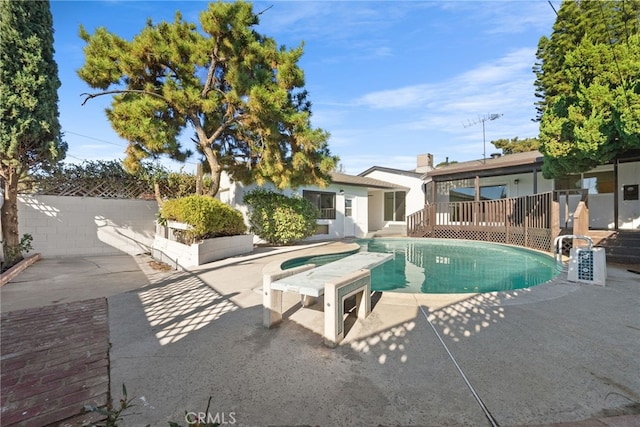 view of swimming pool featuring a fenced in pool, fence, and a patio area