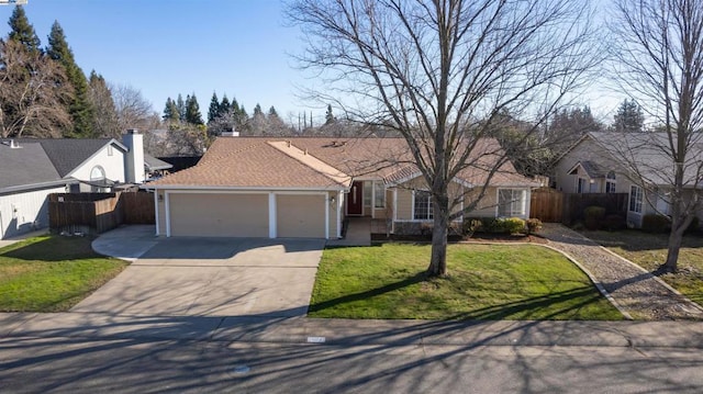 ranch-style house with a garage and a front lawn