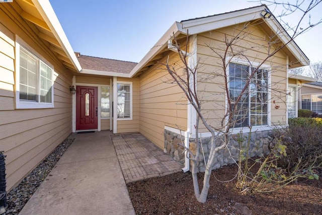 property entrance featuring a patio area