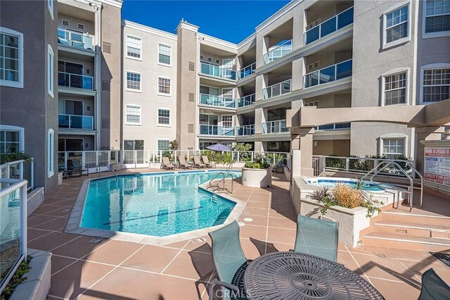 view of swimming pool with a patio