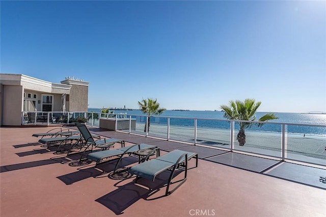 view of patio featuring a water view