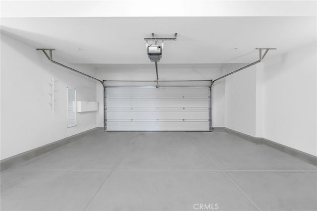 garage featuring a garage door opener