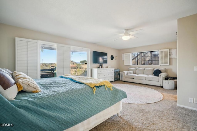 bedroom with ceiling fan and carpet floors