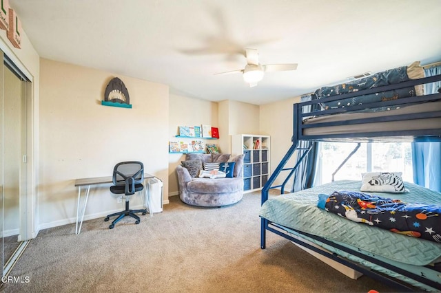 bedroom featuring ceiling fan, a closet, and carpet flooring