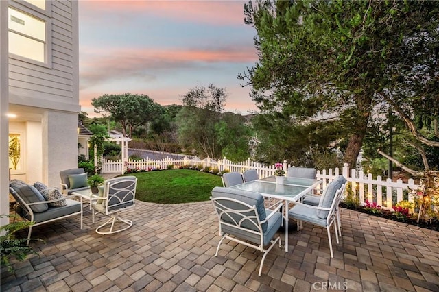 patio terrace at dusk with a yard