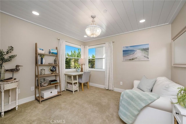 carpeted office featuring a notable chandelier and wood ceiling