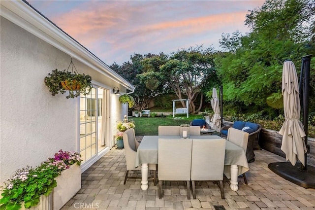 view of patio terrace at dusk