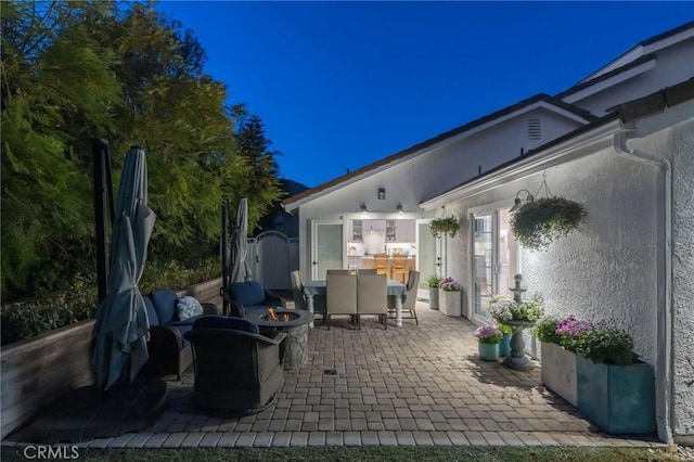 view of patio / terrace featuring a fire pit