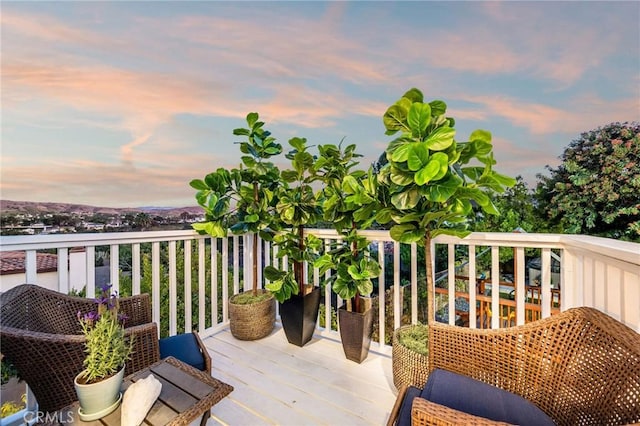 view of balcony at dusk