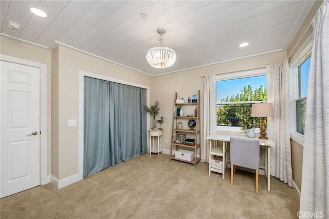 carpeted office with a chandelier