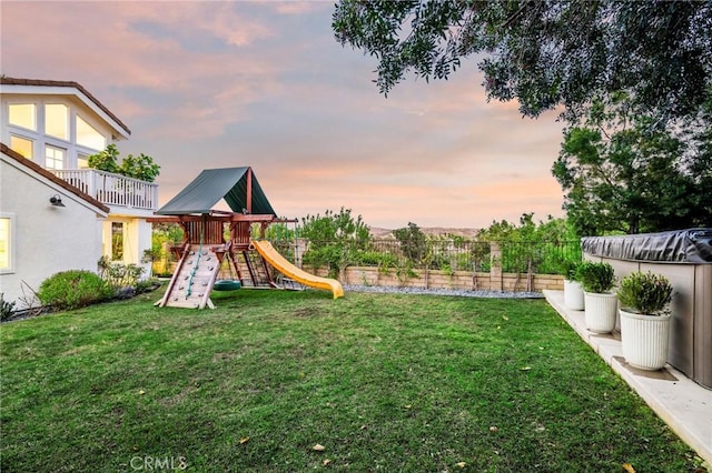 yard at dusk with a playground