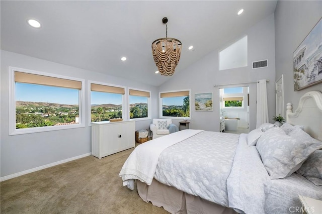 bedroom featuring a chandelier, light colored carpet, high vaulted ceiling, and multiple windows