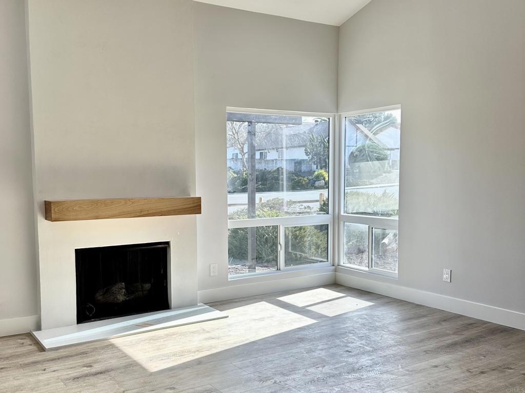 unfurnished living room featuring light hardwood / wood-style floors