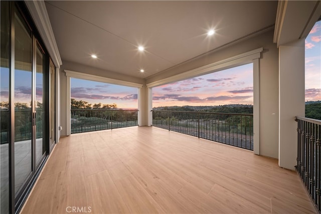 view of balcony at dusk