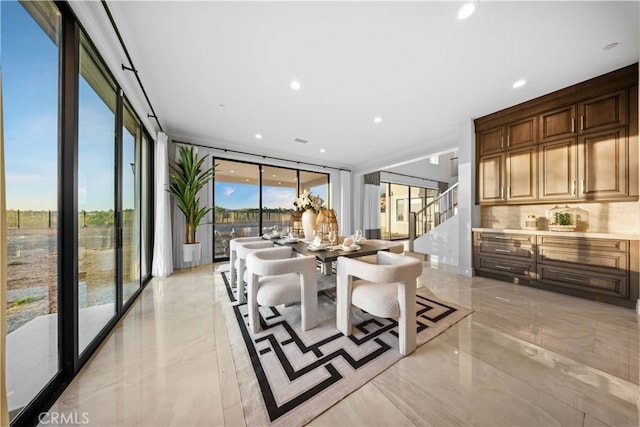 dining room featuring floor to ceiling windows