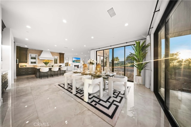 dining room featuring floor to ceiling windows