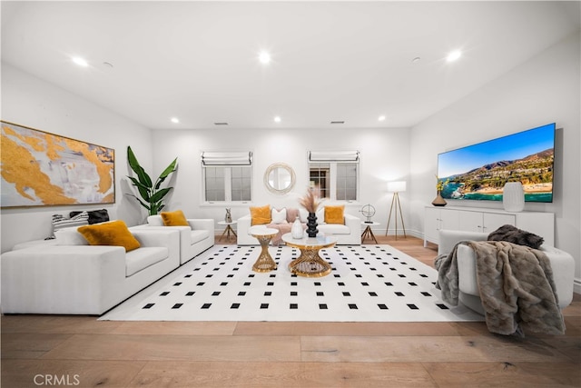 living room with light hardwood / wood-style flooring