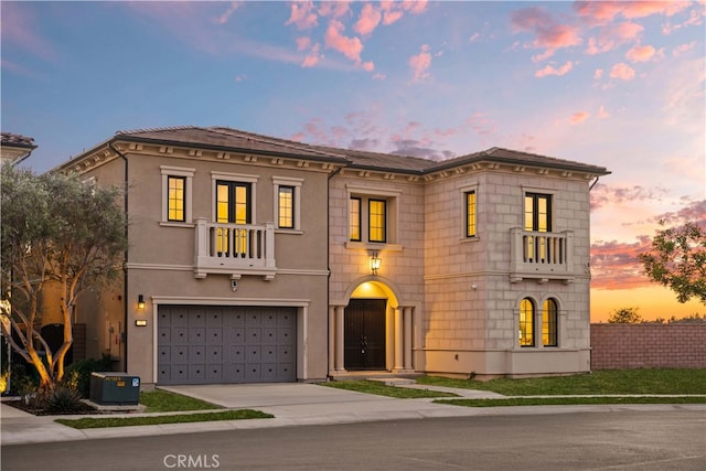 view of front of home featuring central air condition unit and a garage