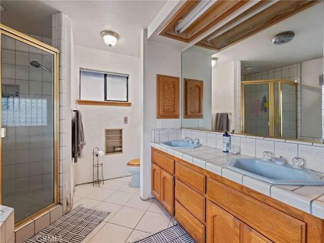20276 Waco Rd, Apple Valley, CA 92308 - bathroom with toilet, tile patterned floors, an enclosed shower, and vanity