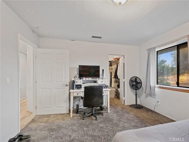 20276 Waco Rd, Apple Valley, CA 92308 - carpeted bedroom with a spacious closet, a textured ceiling, and a closet