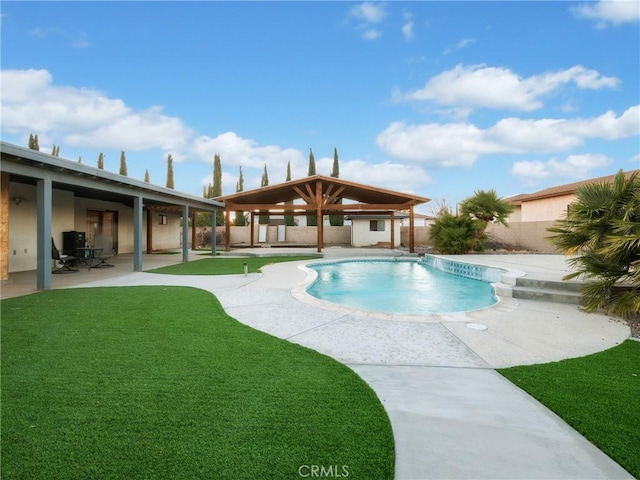 view of swimming pool featuring a lawn and a patio