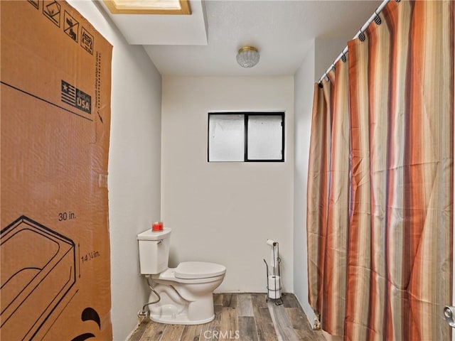 20276 Waco Rd, Apple Valley, CA 92308 - bathroom featuring toilet and hardwood / wood-style flooring