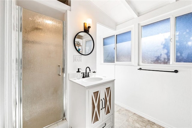 bathroom featuring vanity, walk in shower, and lofted ceiling