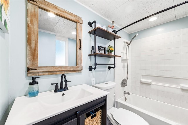 full bathroom featuring vanity, tiled shower / bath combo, and toilet