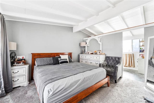 bedroom featuring lofted ceiling with beams and light carpet