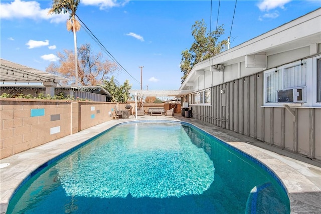 view of swimming pool featuring a pergola and cooling unit