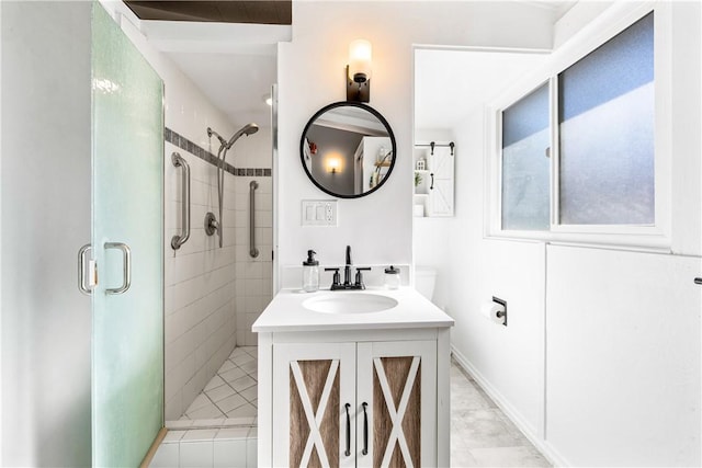 bathroom featuring an enclosed shower and vanity